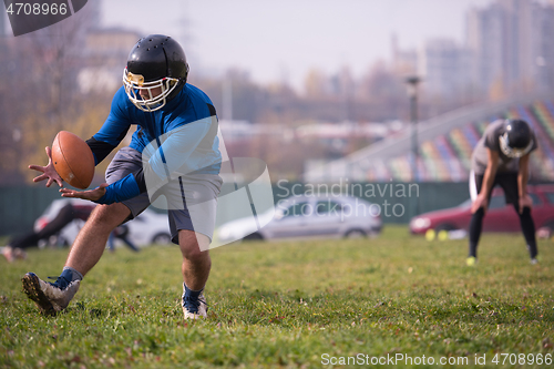 Image of american football team in action