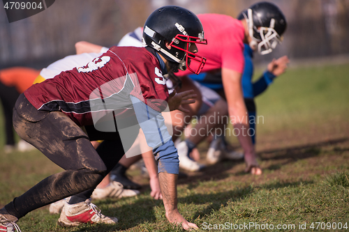 Image of american football team in action