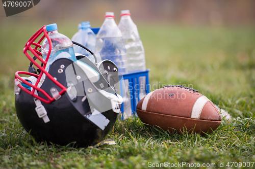 Image of American football helmet and ball