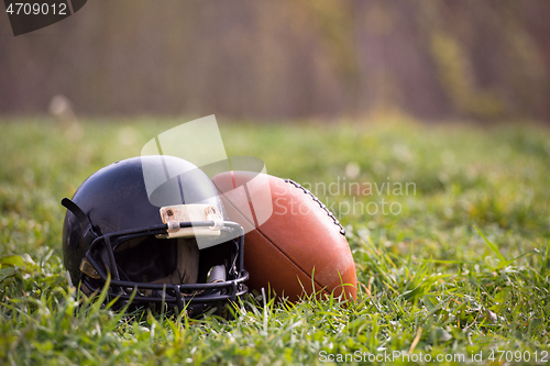 Image of American football helmet and ball