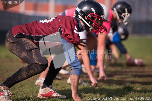 Image of american football team in action