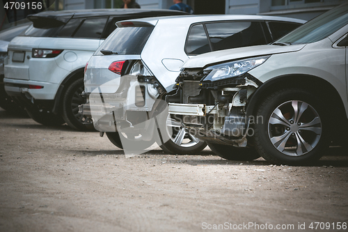 Image of Broken and crashed modern car after an accident on street