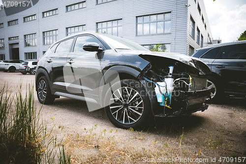 Image of Broken and crashed modern car after an accident on street