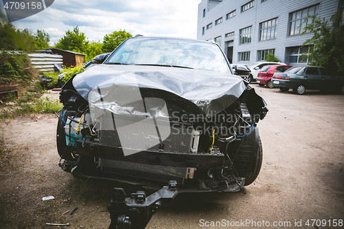 Image of Broken and crashed modern car after an accident on street