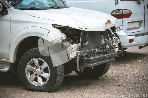 Image of Broken and crashed modern car after an accident on street