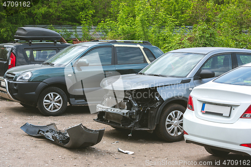 Image of Broken and crashed modern cars after an accident on street