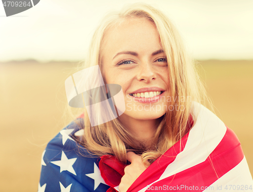 Image of happy woman in american flag on cereal field