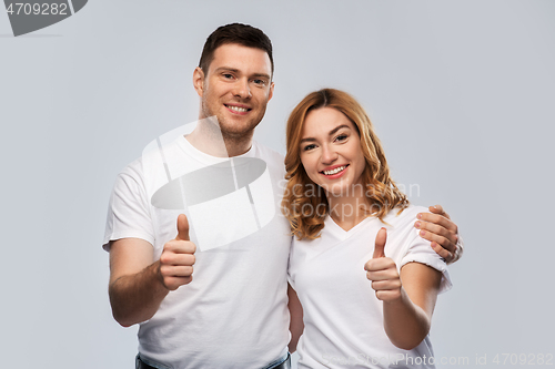 Image of portrait of happy couple in white t-shirts