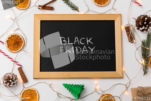 Image of chalk board with black friday words on christmas