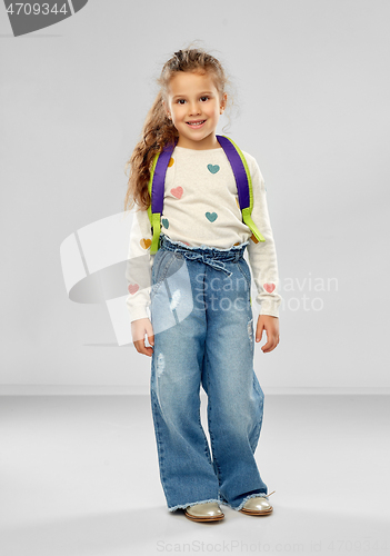 Image of happy little girl with school backpack