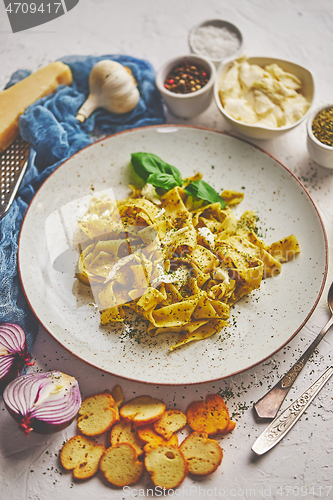 Image of Tasty tagliatelle pasta with basil and green pesto