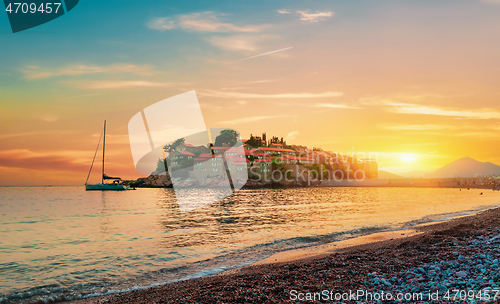 Image of Island in sea at sunset