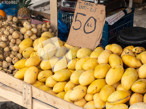 Image of Ripe yellow mango at market