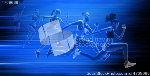 Image of Young african-american and caucasian man and women running isolated on blue studio background