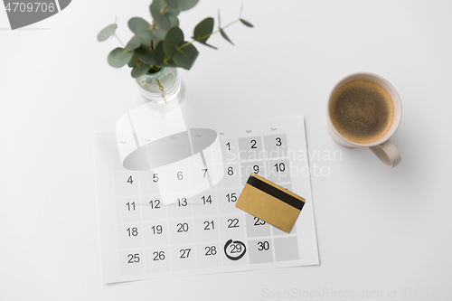 Image of black friday on calendar, credit card and coffee