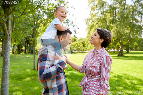 Image of happy family having fun at summer park