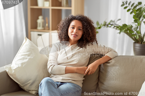 Image of happy african american young woman at home