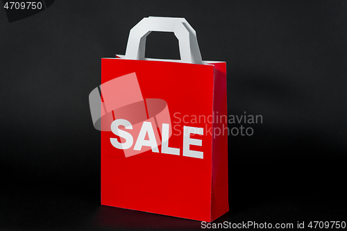 Image of red shopping bag with sale word