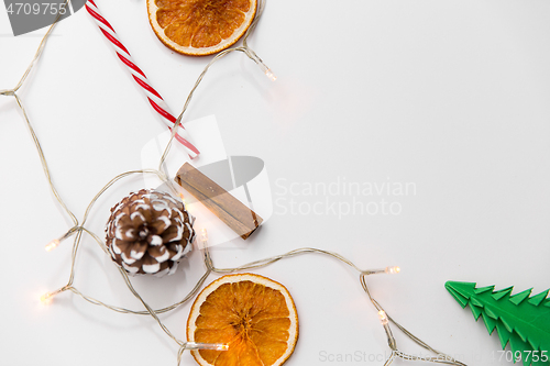 Image of frame of garland lights and christmas decorations