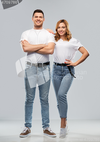 Image of portrait of happy couple in white t-shirts