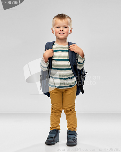 Image of portrait of smiling boy with school backpack