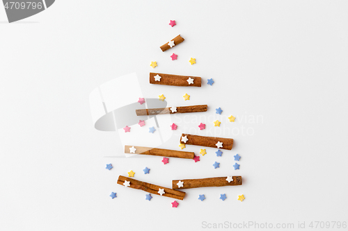 Image of christmas tree of cinnamon sticks and sprinkles