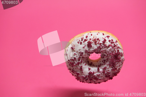 Image of Macro shoot of donut on pink