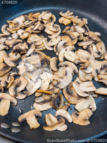 Image of Fried mushrooms in pan