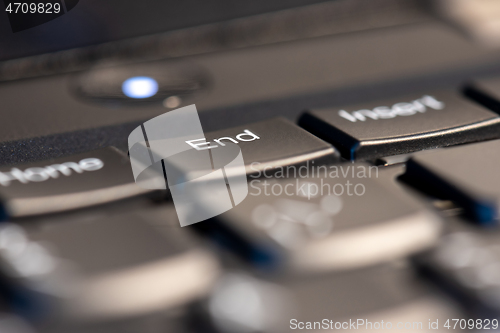 Image of Macro shot of black keyboard focus on end key