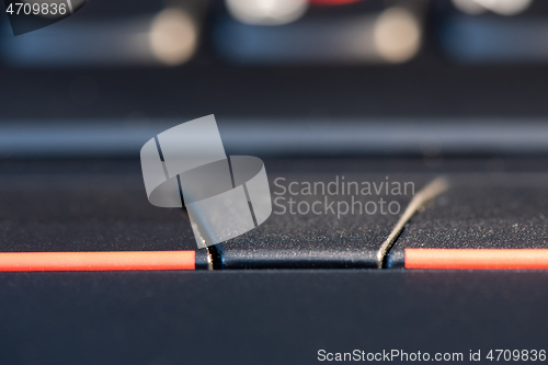 Image of Macro shot of black keyboard focus on touchpad
