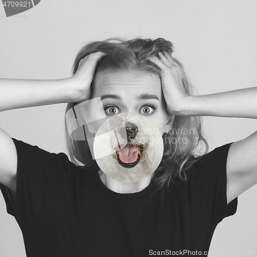 Image of Contemporary artwork collage concept. Portrait of woman with pet\'s tongue sticked out, bw style