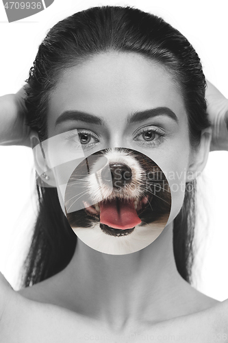 Image of Contemporary artwork collage concept. Portrait of woman with pet\'s tongue sticked out, bw style