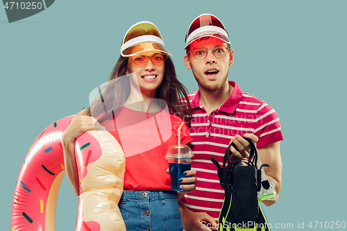 Image of Beautiful couple isolated on blue studio background