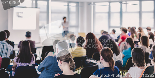 Image of Speaker giving presentation on business conference.