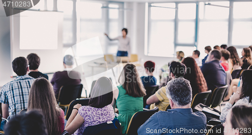 Image of Speaker giving presentation on business conference.