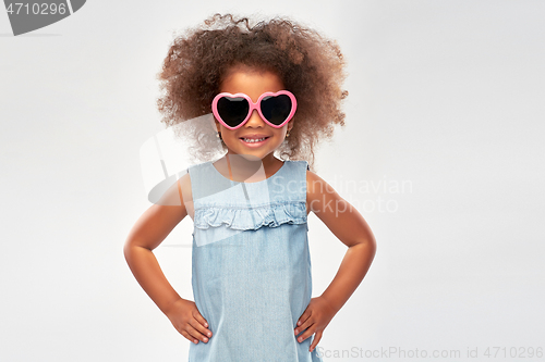 Image of little african girl in heart shaped sunglasses