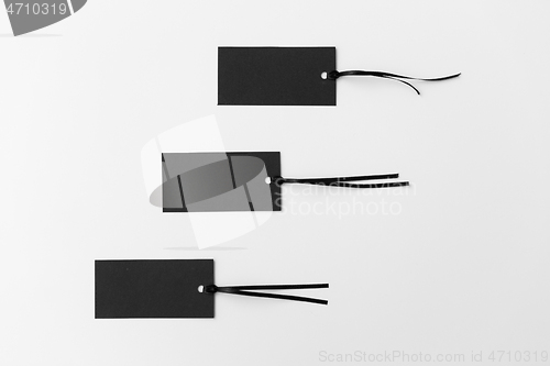 Image of three black tags on white background