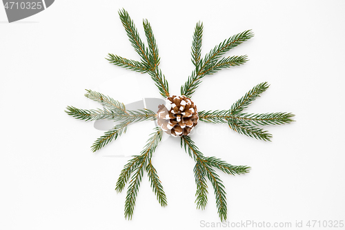 Image of christmas ornament of fir branches and pine cone