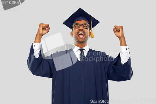 Image of happy indian graduate student celebrating success