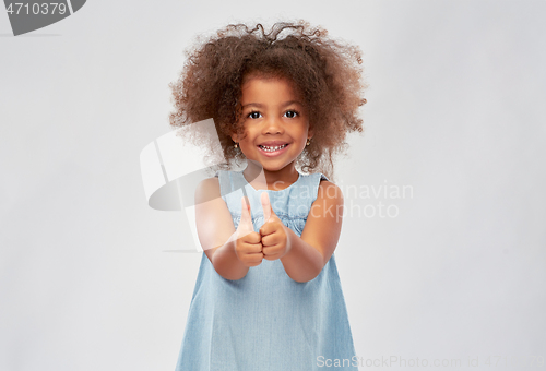 Image of little african american girl showing thumbs up