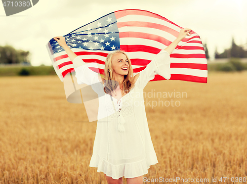 Image of happy woman with american flag on cereal field