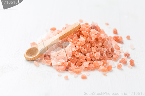 Image of Organic Himalayan with small spoon on white background