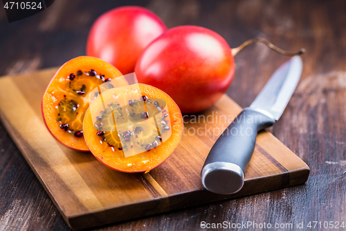 Image of Organic tamarillo (tree tomato) on cutting board