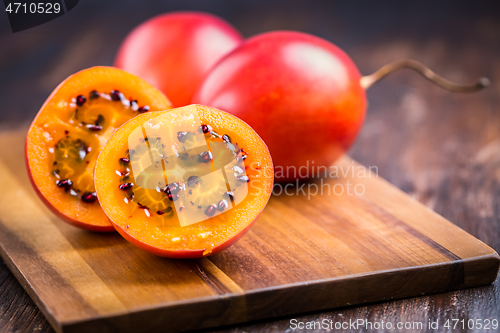 Image of Organic tamarillo (tree tomato) on cutting board