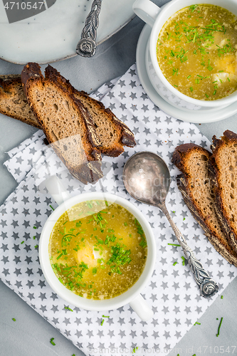 Image of Homemade egg soup with fresh sourdough bread