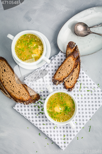 Image of Homemade egg soup with fresh sourdough bread
