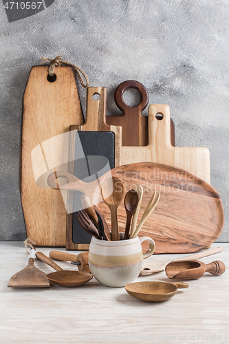 Image of Assortment of wooden cutting boards and kitchen utensils