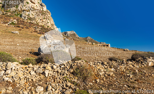 Image of Landscape with rocky ground, rock, wall and house. Sicily