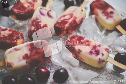 Image of Delicious, homemade popsicles made from cherries and cream.