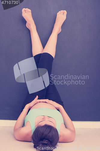 Image of pregnant women laying on the floor